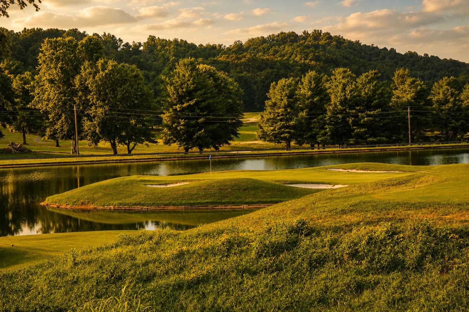 Bunkers and fairway at Graysburg Hills under a low evening sky